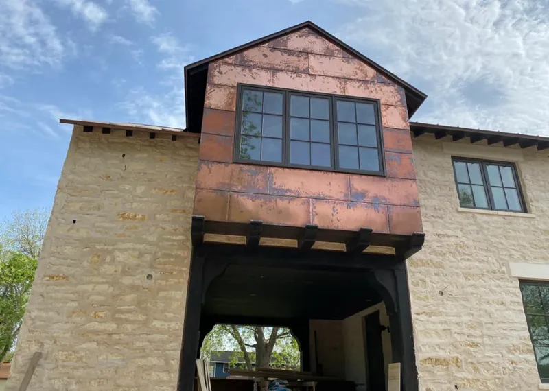 Copper metal panel facade on a stone building for Metal Roof Coating in Bryn Mawr-Skyway