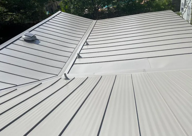 Solar attic fan installed on a metal roof for Roof Ventilation in Bryn Mawr-Skyway